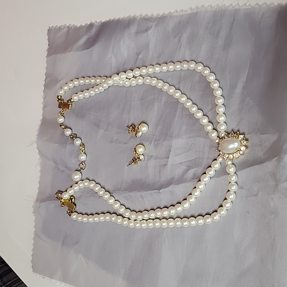Beautiful faux pearl necklace and earrings set.Avon set